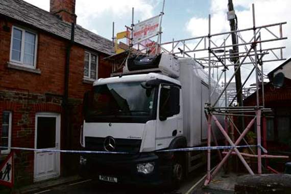 van trapped under scaffolding